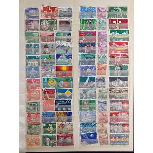 242 - Four stamp collector albums. Includes three A4 examples which are full of AU unmounted Canadian, New... 