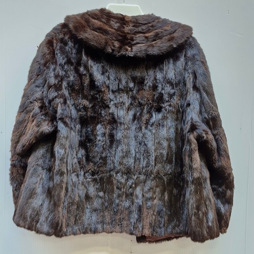 305 - A short ladies Rohu Ltd Dublin exclusive furriers cropped fur coat. Approx. size 12.