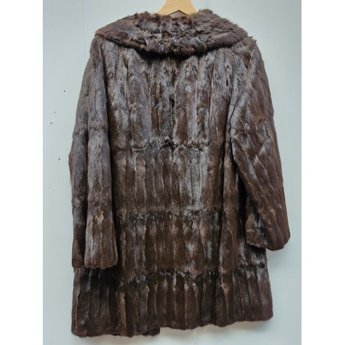 310 - A Vintage Rohu Ltd Dublin fur coat with satin lining. With Label 'Exclusive Furriers Rohu Ltd Dublin... 