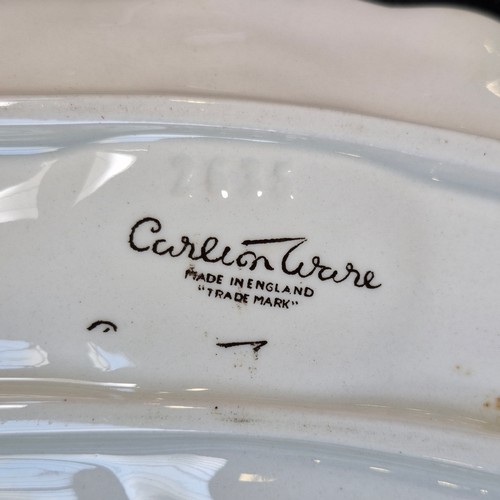 395 - Four super fun Carlton Ware ceramic pieces including a salad bowl with salad spoons, a sauce boat wi... 