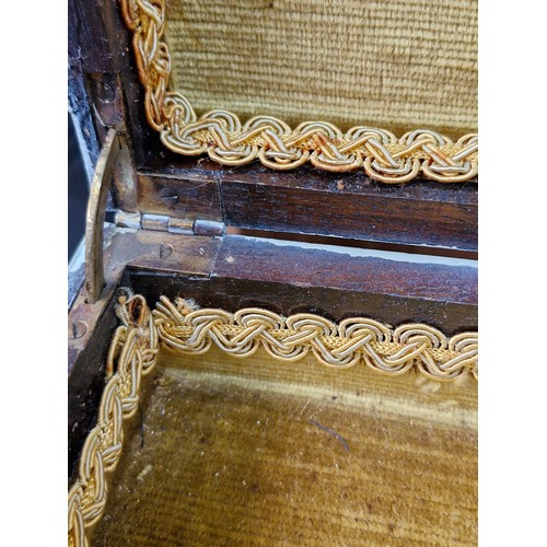 375 - A vintage ladies work / sewing table featuring a mustard fabric lined interior and braiding, turned ... 