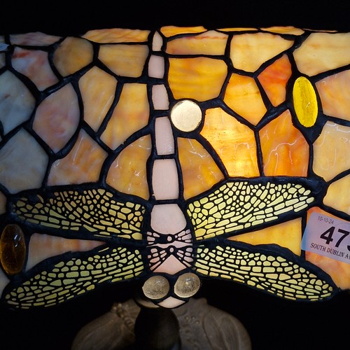 473 - Star lot : A Tiffany-style table lamp with dragonfly motif stained glass shade and ornate cast metal... 