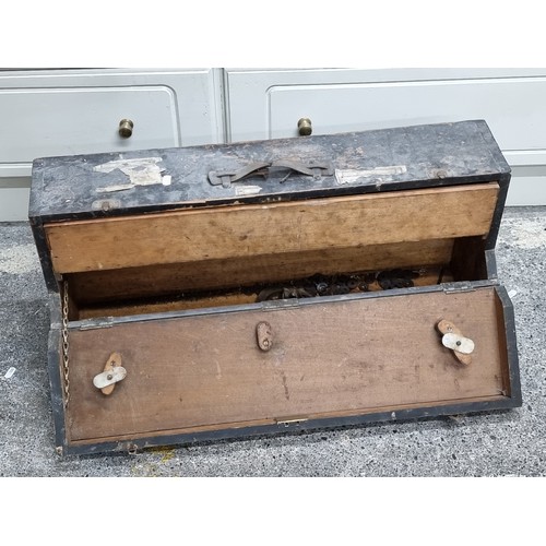 717 - A fascinating antique carpenters tool box, opens to reveal a large pull out drawers filled with a se... 