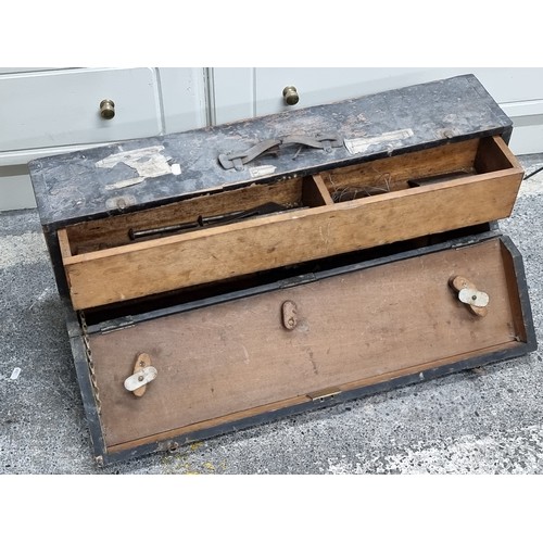 717 - A fascinating antique carpenters tool box, opens to reveal a large pull out drawers filled with a se... 