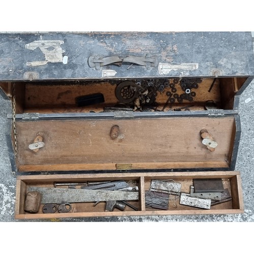 717 - A fascinating antique carpenters tool box, opens to reveal a large pull out drawers filled with a se... 