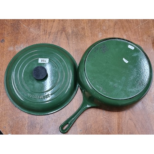 768 - A Fabulous Le Creuset heavy cast iron lidded saucepan in a lovely Earthy green. In good condition.