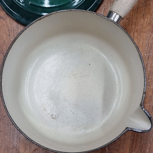 774 - A Le Creuset lidded saucepan with wooden handle. In very good condition.