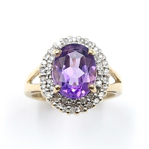 1 - Star Lot : A very nice example of a nine carat gold diamond and large amethyst gemstone ring. Ring s... 