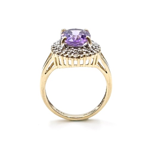 1 - Star Lot : A very nice example of a nine carat gold diamond and large amethyst gemstone ring. Ring s... 