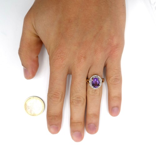 1 - Star Lot : A very nice example of a nine carat gold diamond and large amethyst gemstone ring. Ring s... 