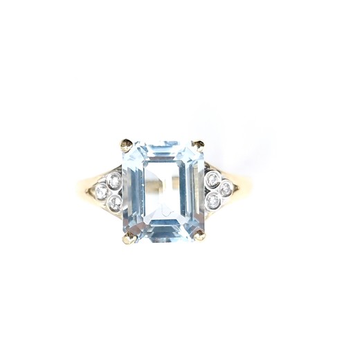 5 - Star Lot : A beautiful example of a largeaquamarine stone ring set with diamonds mounted in nine car... 