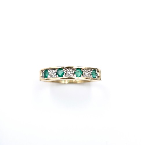 6 - Star Lot : A 9ct gold half eternity four stone emerald  and diamond ring. Size - K 1/2. Weight - 2.4... 