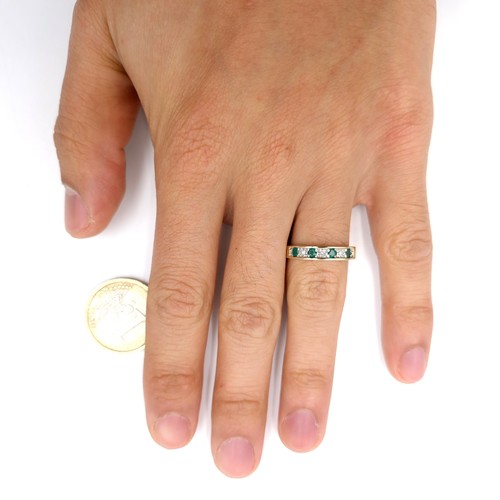 6 - Star Lot : A 9ct gold half eternity four stone emerald  and diamond ring. Size - K 1/2. Weight - 2.4... 