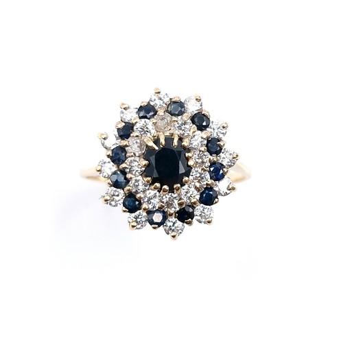 7 - Star Lot : A large vintage sapphire and diamond cluster ring set in nine carat gold. Size - V. Weigh... 