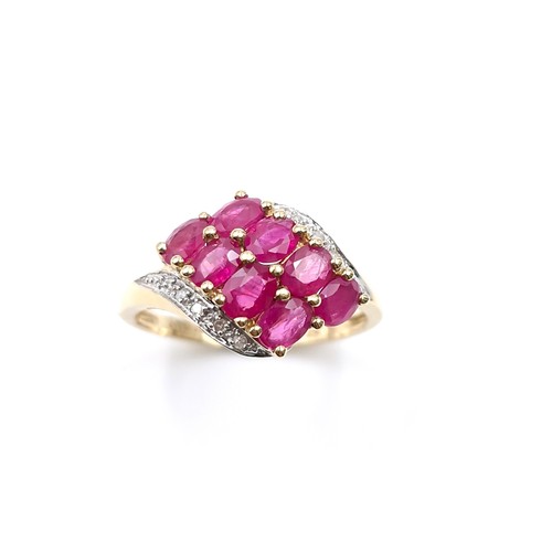 9 - Star Lot A very pretty nine carat gold ruby and diamond dress ring. Ring size - O. Weight - 2.78 gra... 