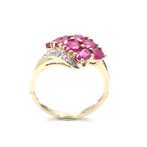 9 - Star Lot A very pretty nine carat gold ruby and diamond dress ring. Ring size - O. Weight - 2.78 gra... 