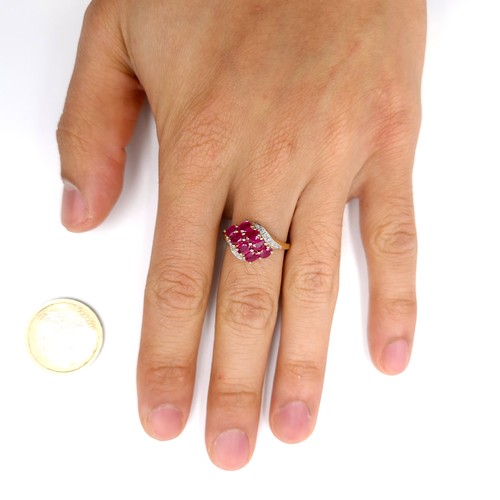 9 - Star Lot A very pretty nine carat gold ruby and diamond dress ring. Ring size - O. Weight - 2.78 gra... 