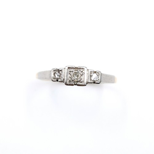 10 - Star Lot : A pretty nine carat gold and platinum diamond ring. Size - M 1/2. Weight - 1.78 grams.