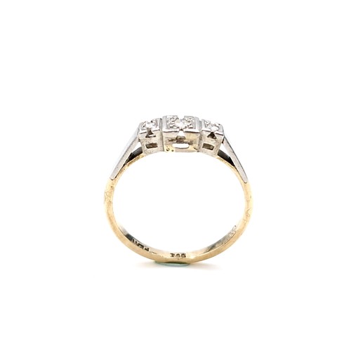 10 - Star Lot : A pretty nine carat gold and platinum diamond ring. Size - M 1/2. Weight - 1.78 grams.