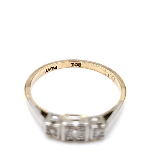 10 - Star Lot : A pretty nine carat gold and platinum diamond ring. Size - M 1/2. Weight - 1.78 grams.