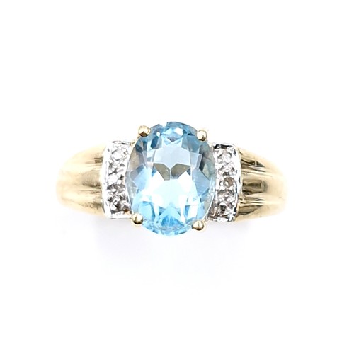 12 - Star Lot : A fabulous large blue topaz and diamond ring set in nine carat gold. Ring size - L 1/2. W... 