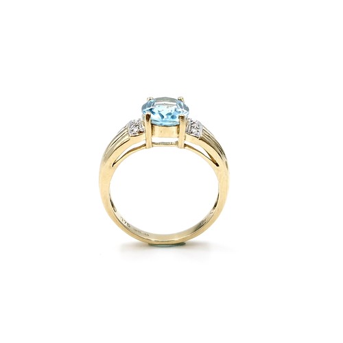 12 - Star Lot : A fabulous large blue topaz and diamond ring set in nine carat gold. Ring size - L 1/2. W... 