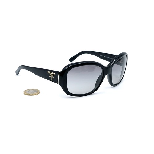 21 - A pair of original designer Prada sunglasses 'Made in Italy' with serial marks to frame. Lenses in g... 