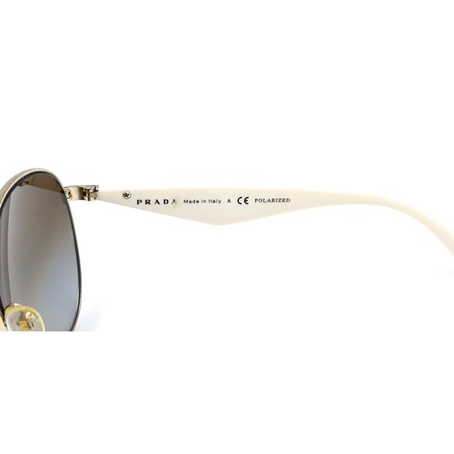 22 - A pair of original designer Prada aviator style sunglasses 'Made in Italy'. Marked polarised and ser... 