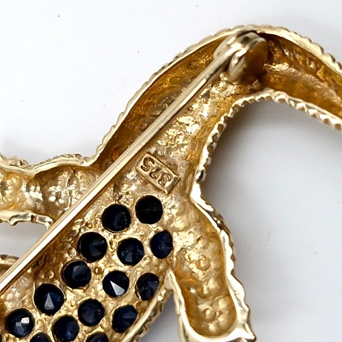 29 - Star Lot : A nice example of a nine carat gold hallmarked crocodile brooch. Set with blue sapphire b... 