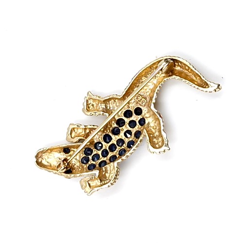 29 - Star Lot : A nice example of a nine carat gold hallmarked crocodile brooch. Set with blue sapphire b... 