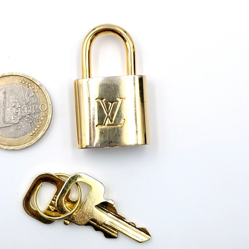 38 - An original  Louis Vuitton pad lock. Weight - 31.52 grams.