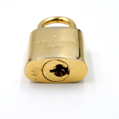 38 - An original  Louis Vuitton pad lock. Weight - 31.52 grams.