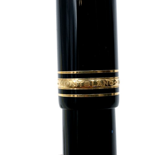 56 - Star Lot : A Mont Blanc fountain pen with a 14 carat (585) nib set with gold toned detailing.