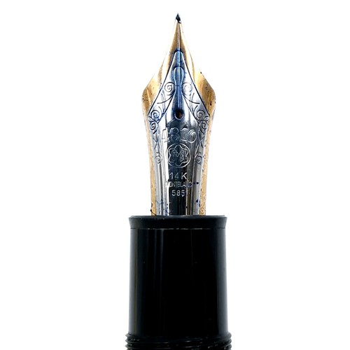 56 - Star Lot : A Mont Blanc fountain pen with a 14 carat (585) nib set with gold toned detailing.