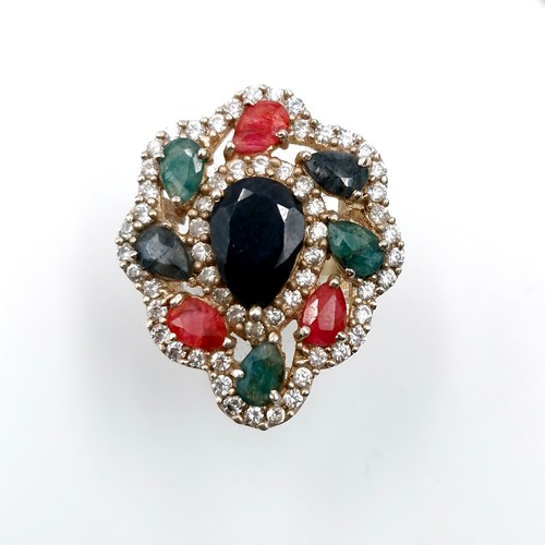 502 - Star Lot : A lovely multi-stone ring with large central sapphire stone with Rubies, Sapphires and Em... 