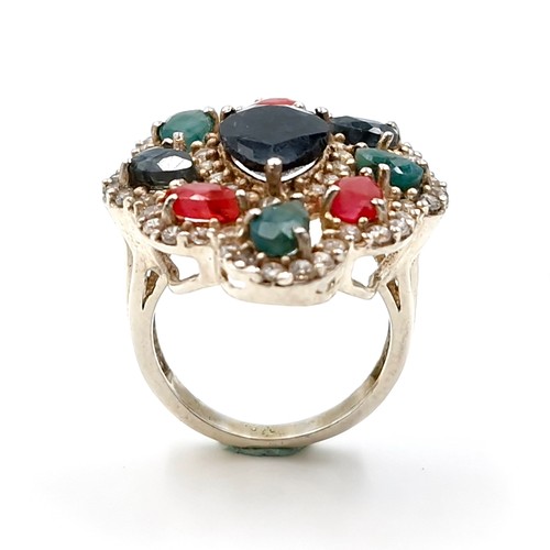 502 - Star Lot : A lovely multi-stone ring with large central sapphire stone with Rubies, Sapphires and Em... 