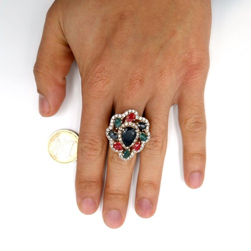 502 - Star Lot : A lovely multi-stone ring with large central sapphire stone with Rubies, Sapphires and Em... 