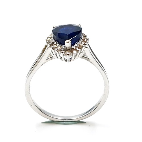 504 - Star Lot : A heart shaped sapphire stone ring with diamond surround set in sterling silver. Ring siz... 