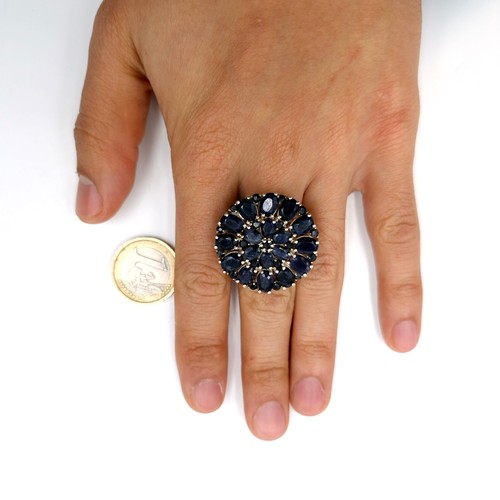 510 - Star Lot : A fabulous large sapphire floral ring. Size - R. Weight - 11.94 grams.  Brand new from th... 