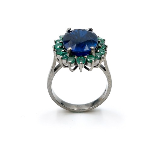 512 - Star Lot : A stunning natural Sapphire and Emerald Ring surround. Size - O. Weight - 5.72 grams.  Br... 