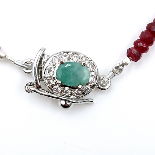 515 - Star lot : A graduated ruby stone necklace with emerald and diamond clasp set in sterling silver. Le... 