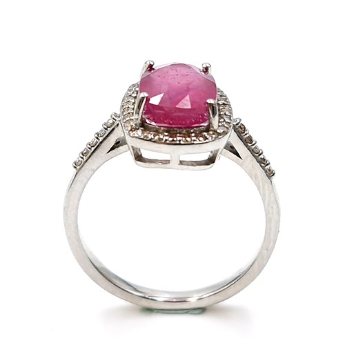 531 - Star lot : A pretty cabochon ruby gemstone ring set with diamond surround mounted in sterling silver... 