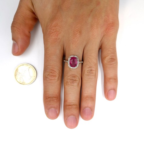 531 - Star lot : A pretty cabochon ruby gemstone ring set with diamond surround mounted in sterling silver... 