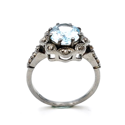 536 - Star Lot : A three carat blue topaz ring with 0.25 carat diamond accents set in sterling silver. Rin... 