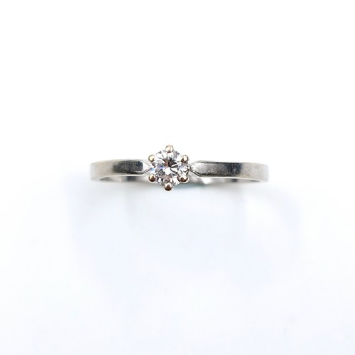 548 - Star Lot : A nine carat white gold Solitaire diamond ring. Est. weight of diamond is 0.20 carats. Ha... 