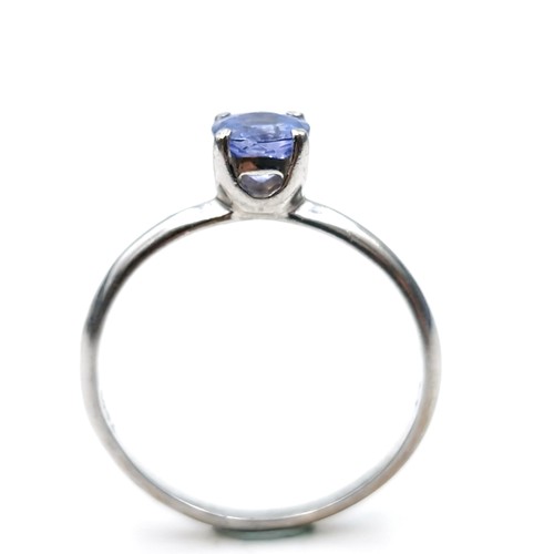 557 - A Tanzanite stone ring set in sterling silver marked TGGC to band (The Genuine Gemstone Company). Ri... 