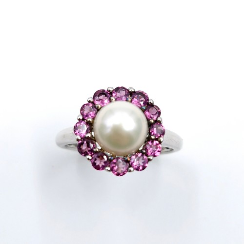 561 - Star Lot : A pretty cabochon pearl and amethyst stone cluster ring with TGGC marked to band (The Gen... 