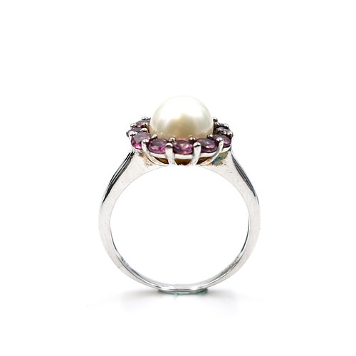 561 - Star Lot : A pretty cabochon pearl and amethyst stone cluster ring with TGGC marked to band (The Gen... 