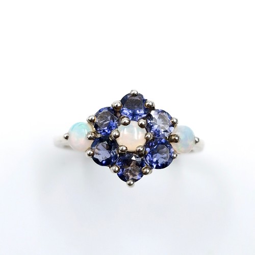 562 - A very fine sapphire & opal cluster ring mounted in sterling silver. Ring size - U. Weight - 3.23 gr... 