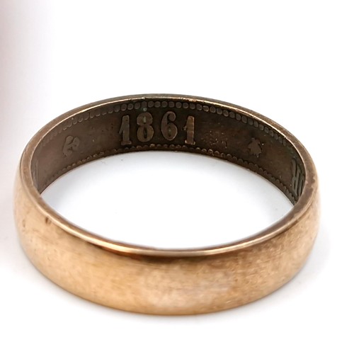 587 - An 1861 Napoleon empire ring stamped to band. Ring size - T. Weight - 2.86 grams. ring is gold plate... 